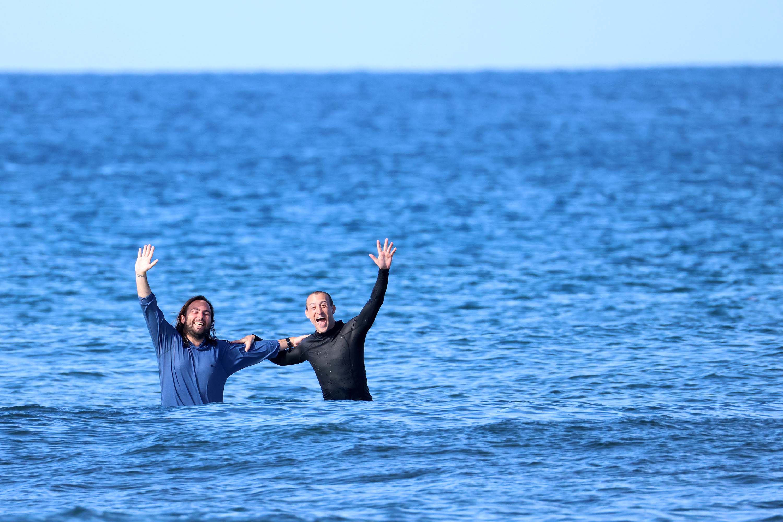 Two BSA coaches celebrating in the water